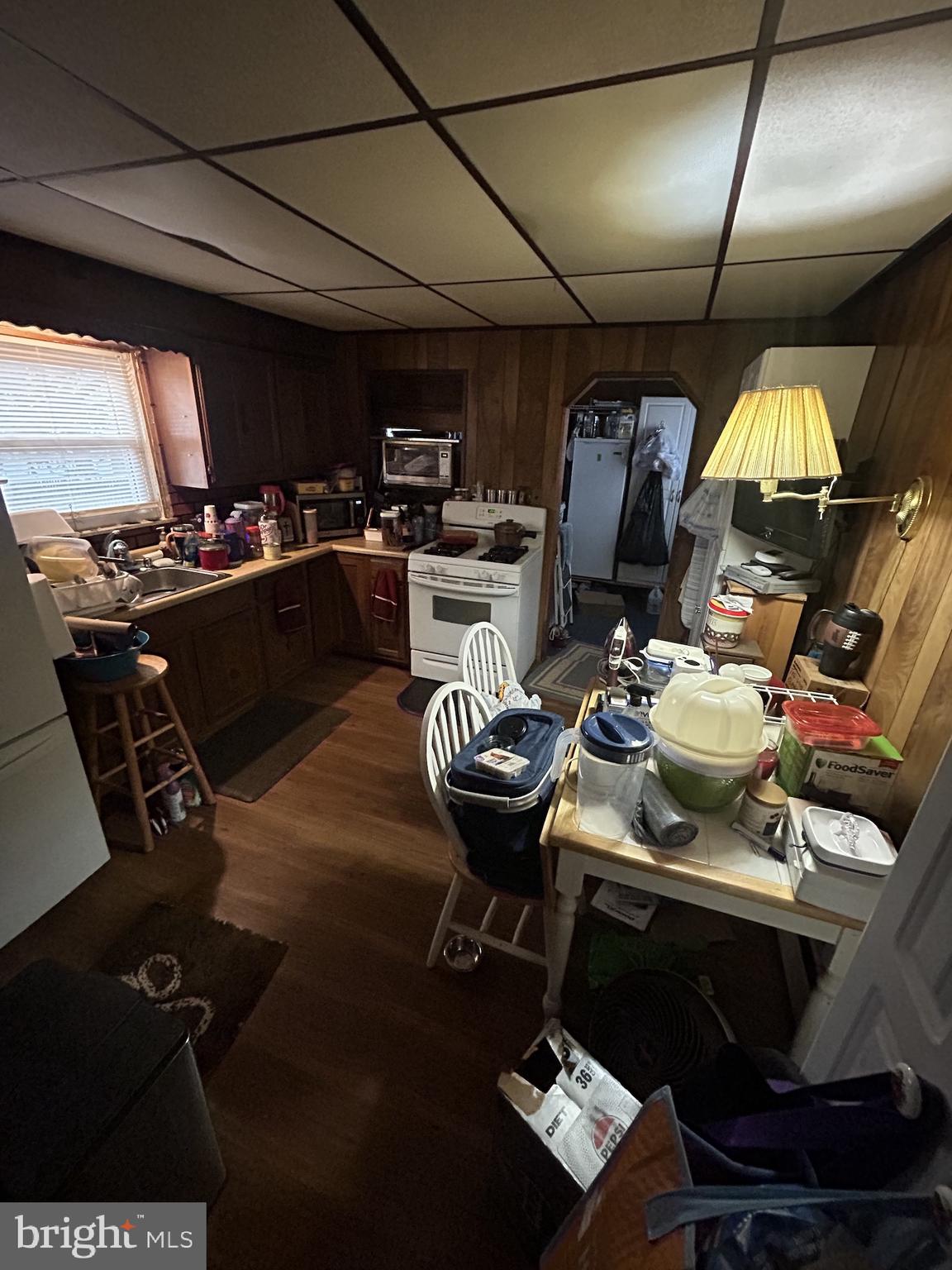 5948 Baltimore Street Baltimore, MD 21207 - Photo 22 of 32 a living room with furniture and a mirror