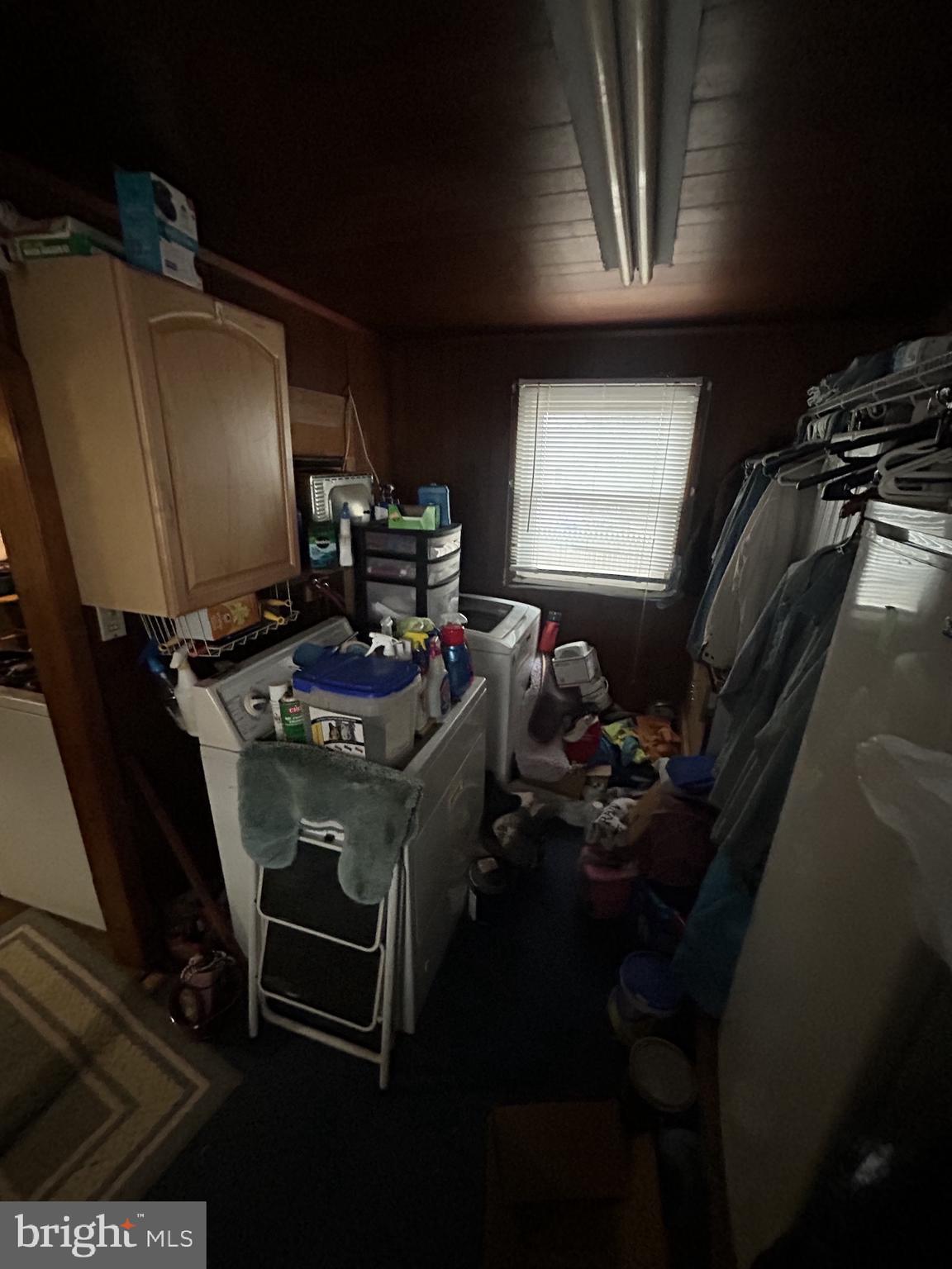 5948 Baltimore Street Baltimore, MD 21207 - Photo 27 of 32 a room with furniture a musical instrument and a window