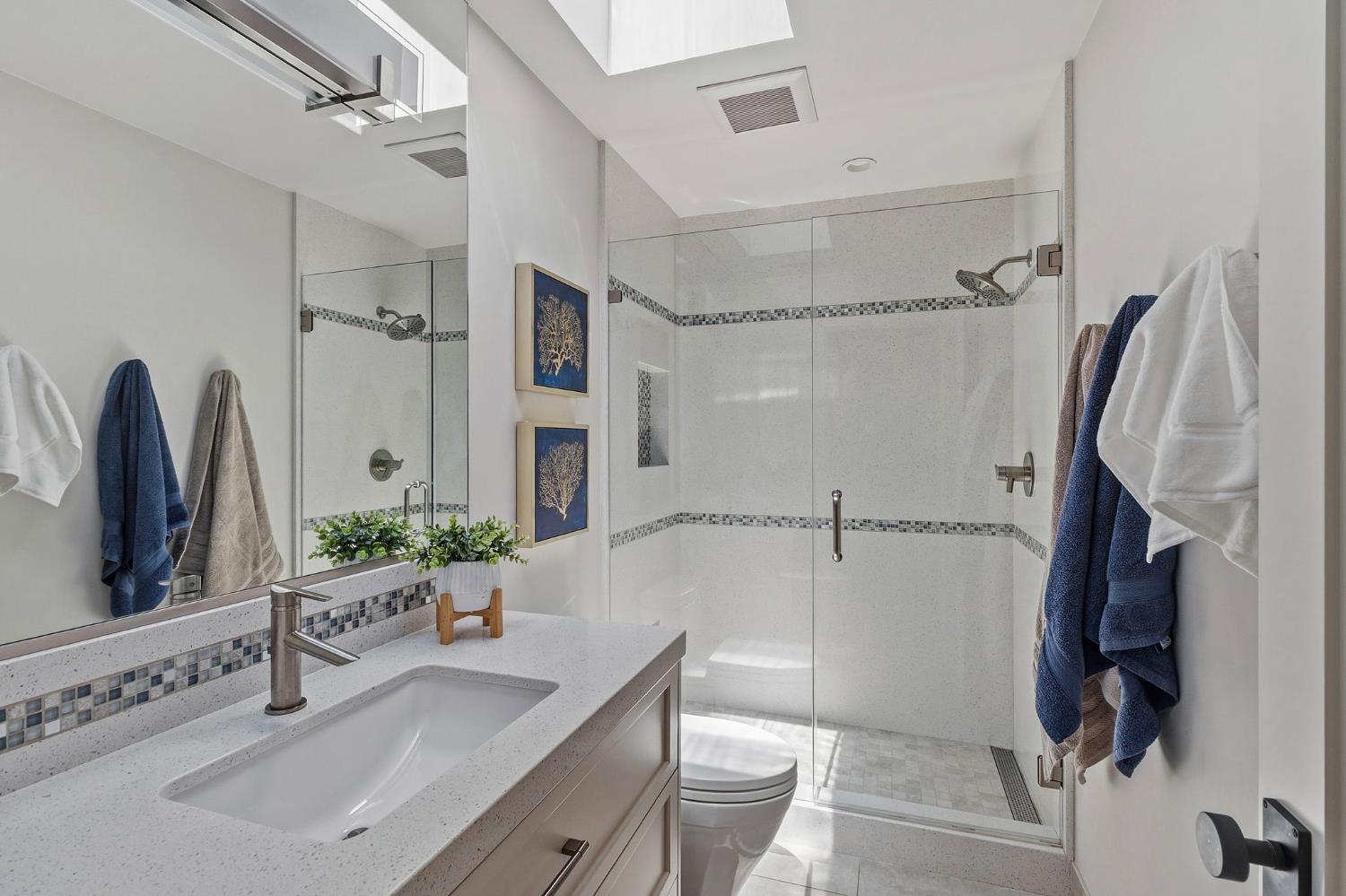 1013 Copper Lake Court Modesto, CA 95355 - Photo 15 of 66 a bathroom with a tub sink and mirror