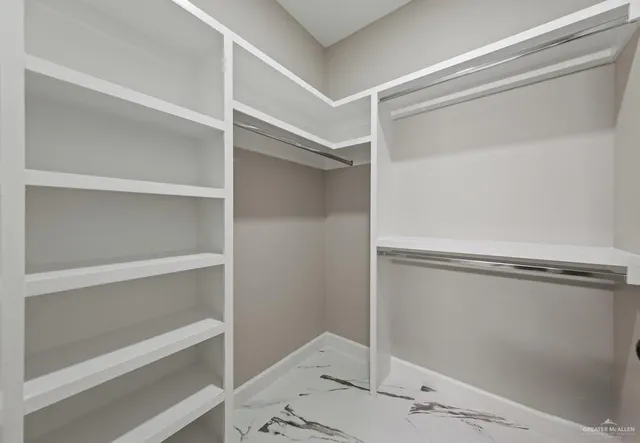 a view of an empty walk in closet