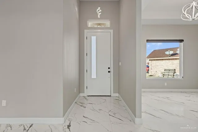 a view of a hallway to rooms