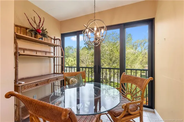 a view of a dining room with furniture window and outside view