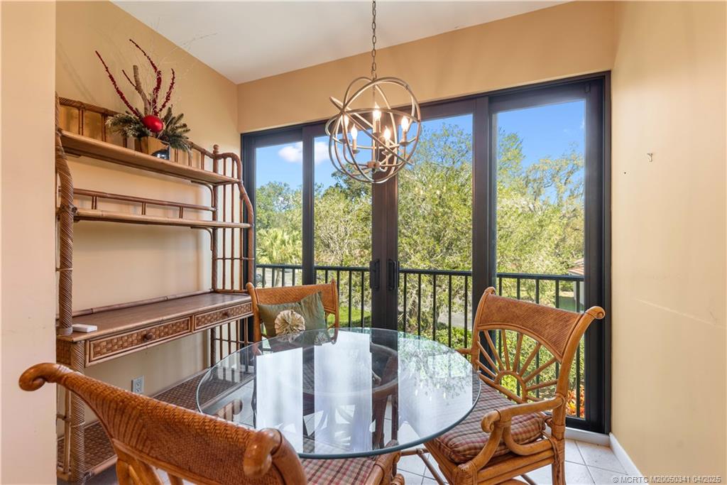 13464 Harbour Ridge Boulevard, Unit 8B Palm City, FL 34990 - Photo 12 of 33 a view of a dining room with furniture window and outside view