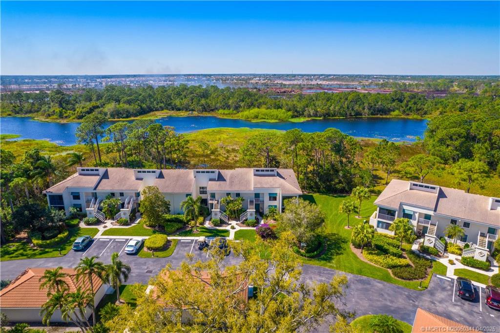 13464 Harbour Ridge Boulevard, Unit 8B Palm City, FL 34990 - Photo 24 of 33 an aerial view of residential houses with outdoor space and swimming pool