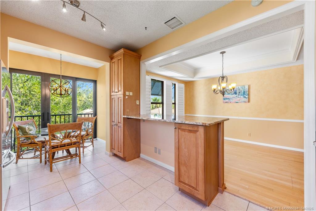 13464 Harbour Ridge Boulevard, Unit 8B Palm City, FL 34990 - Photo 8 of 33 a view of a dining room with furniture window and outside view