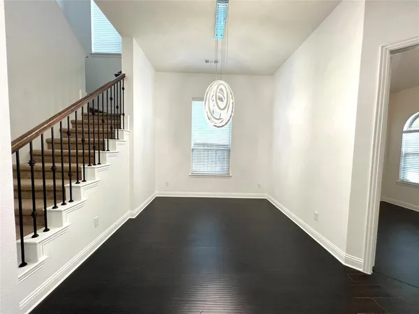 a view of an entryway with wooden floor
