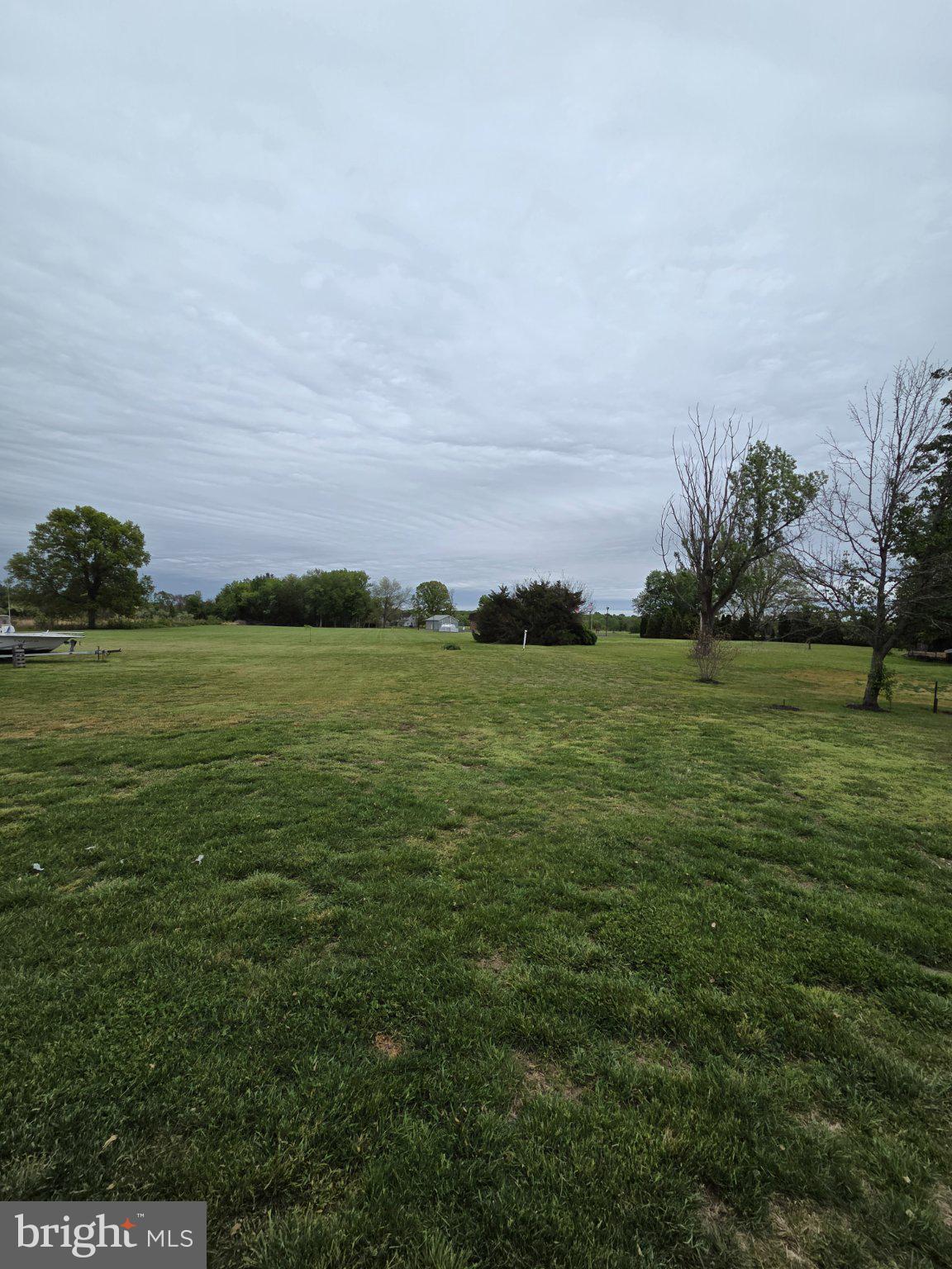 894 Main St - Canton Road Salem, NJ 08079 - Photo 16 of 17 Expansive green landscape under clouds.