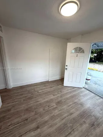 a view of a livingroom with wooden floor