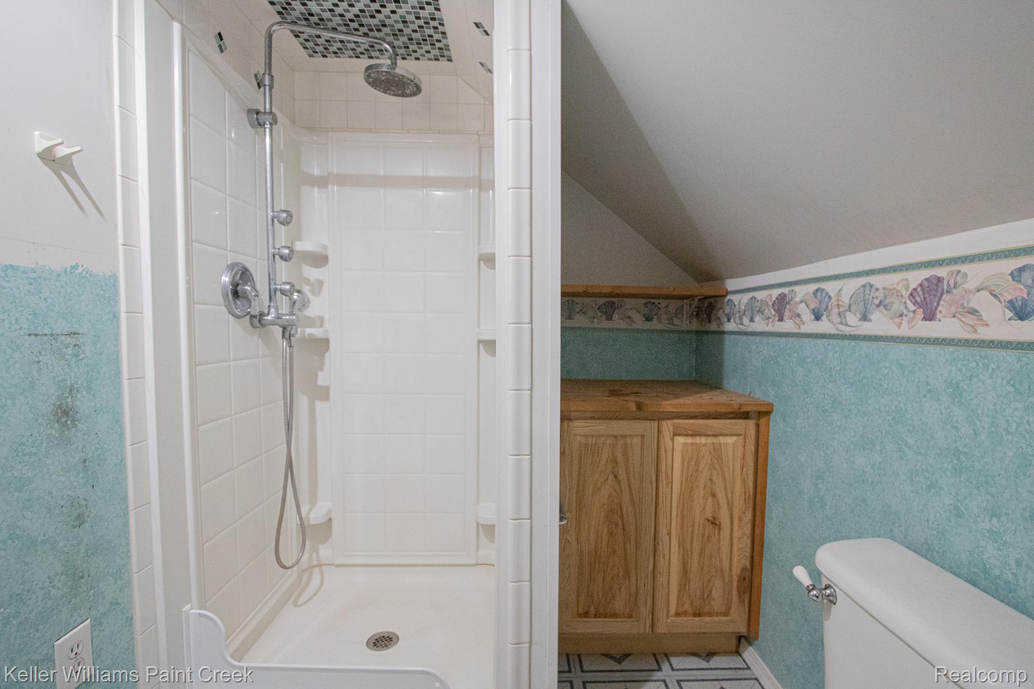 2165 Michigan Road Port Huron, MI 48060 - Photo 26 of 38 Full bathroom with a stall shower and lofted ceiling