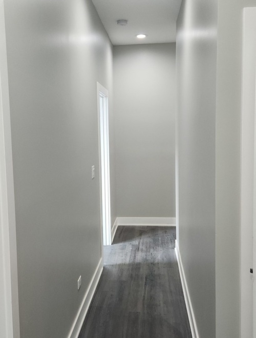 1023 East 45th Street, Unit 2 Chicago, IL 60653 - Photo 4 of 12 a view of hallway with wooden floor