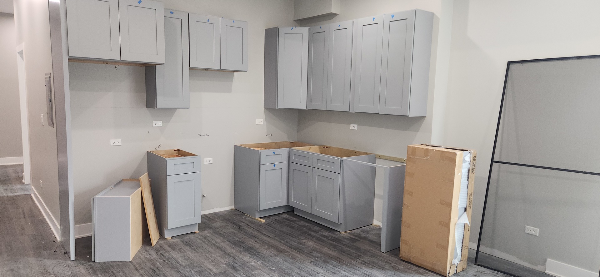 1023 East 45th Street, Unit 2 Chicago, IL 60653 - Photo 9 of 12 a kitchen with refrigerator and white cabinets
