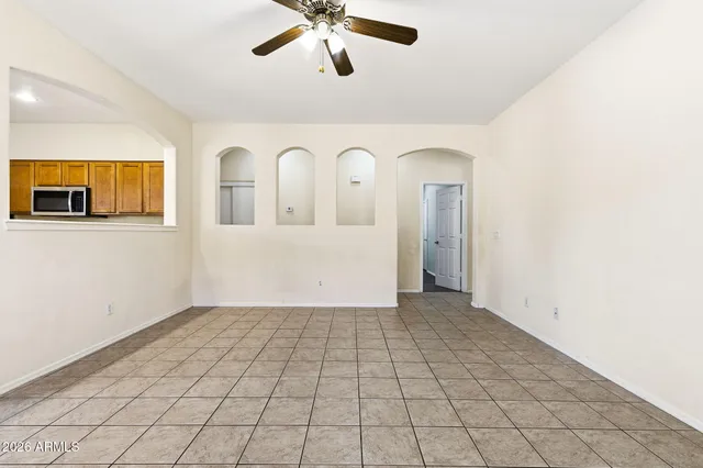 a kitchen with stainless steel appliances granite countertop a refrigerator a sink and a stove