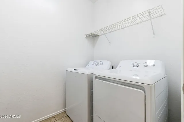 a bathroom with a shower sink vanity and mirror