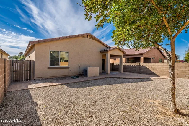 a view of a house with a backyard