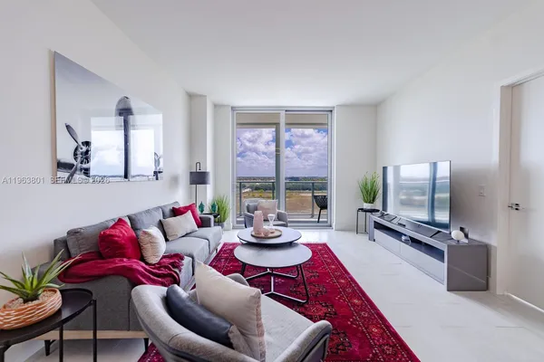 a living room with furniture and a flat screen tv
