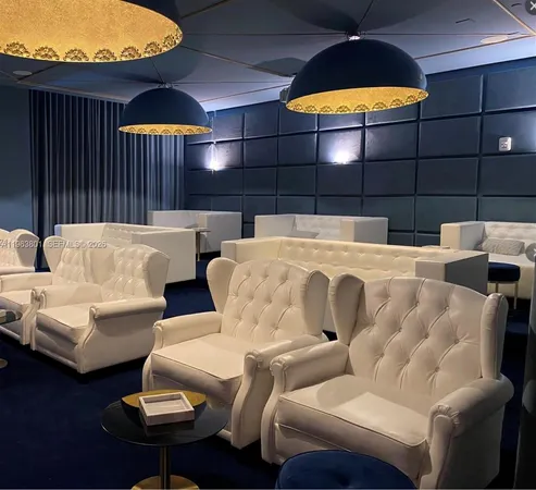 a projector room with furniture and a lamp