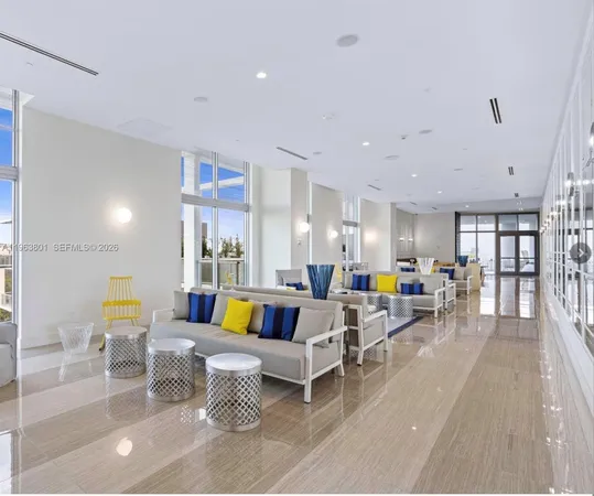a living room with furniture and breakfast area