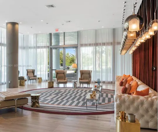 a very nice looking room with a large mirror and a chandelier