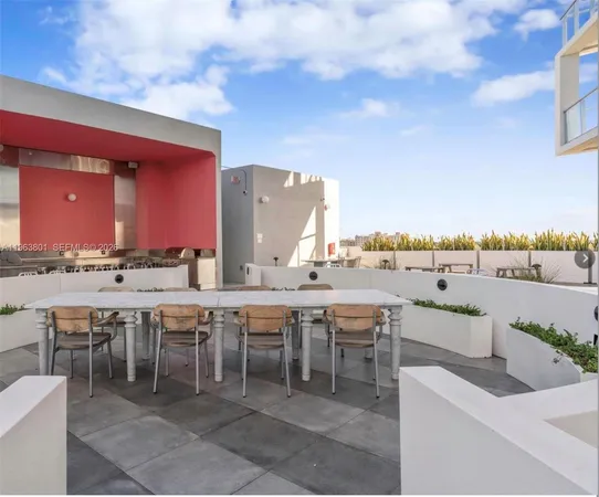 a view of a balcony with wooden floor and fence