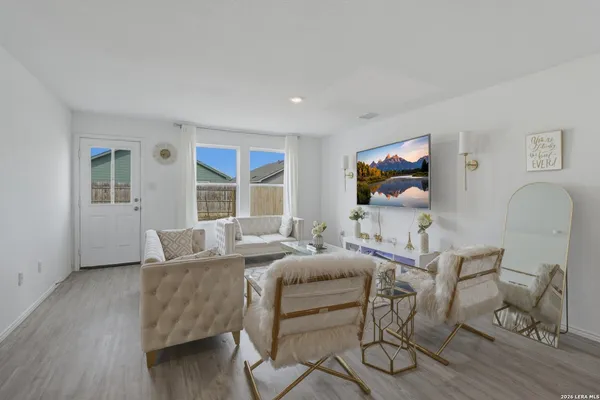 a living room with furniture and a window