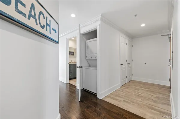 a view of an entryway with wooden floor
