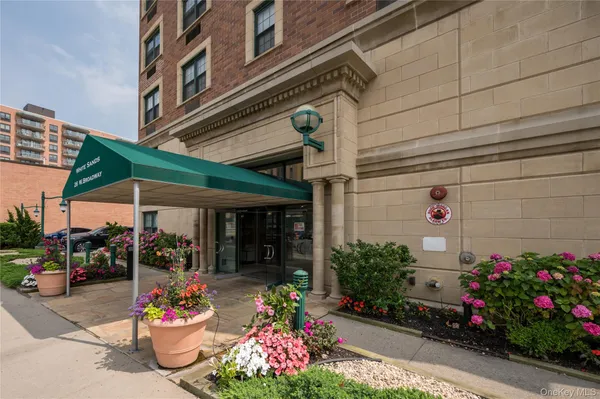 a bunch of flowers in front of building