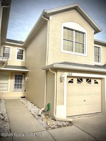 a front view of a house with a garage