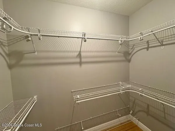 a view of a room with racks on the wall