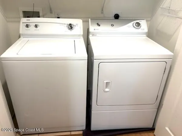 a utility room with dryer and washer