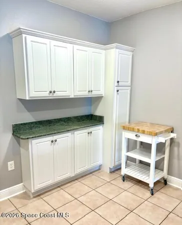 a kitchen with a stove and a refrigerator