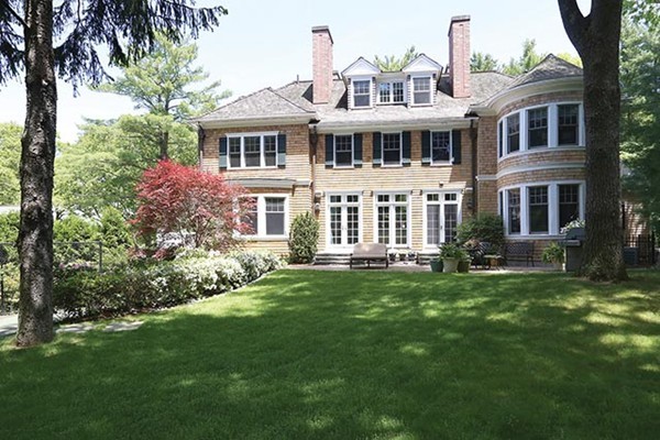 342 Woodland Road Brookline, MA 02467 - Photo 1 of 15 a front view of a house with a garden