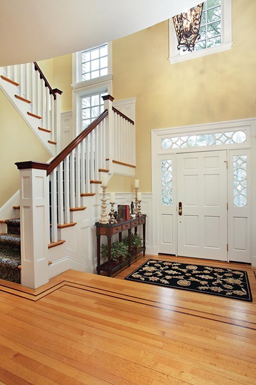 342 Woodland Road Brookline, MA 02467 - Photo 9 of 15 a view of a livingroom with wooden floor and stairs