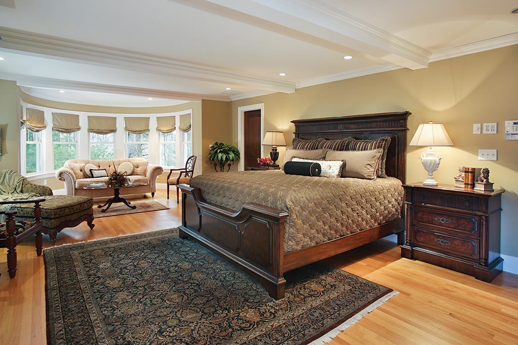 342 Woodland Road Brookline, MA 02467 - Photo 10 of 15 a bedroom with a bed and wooden floor