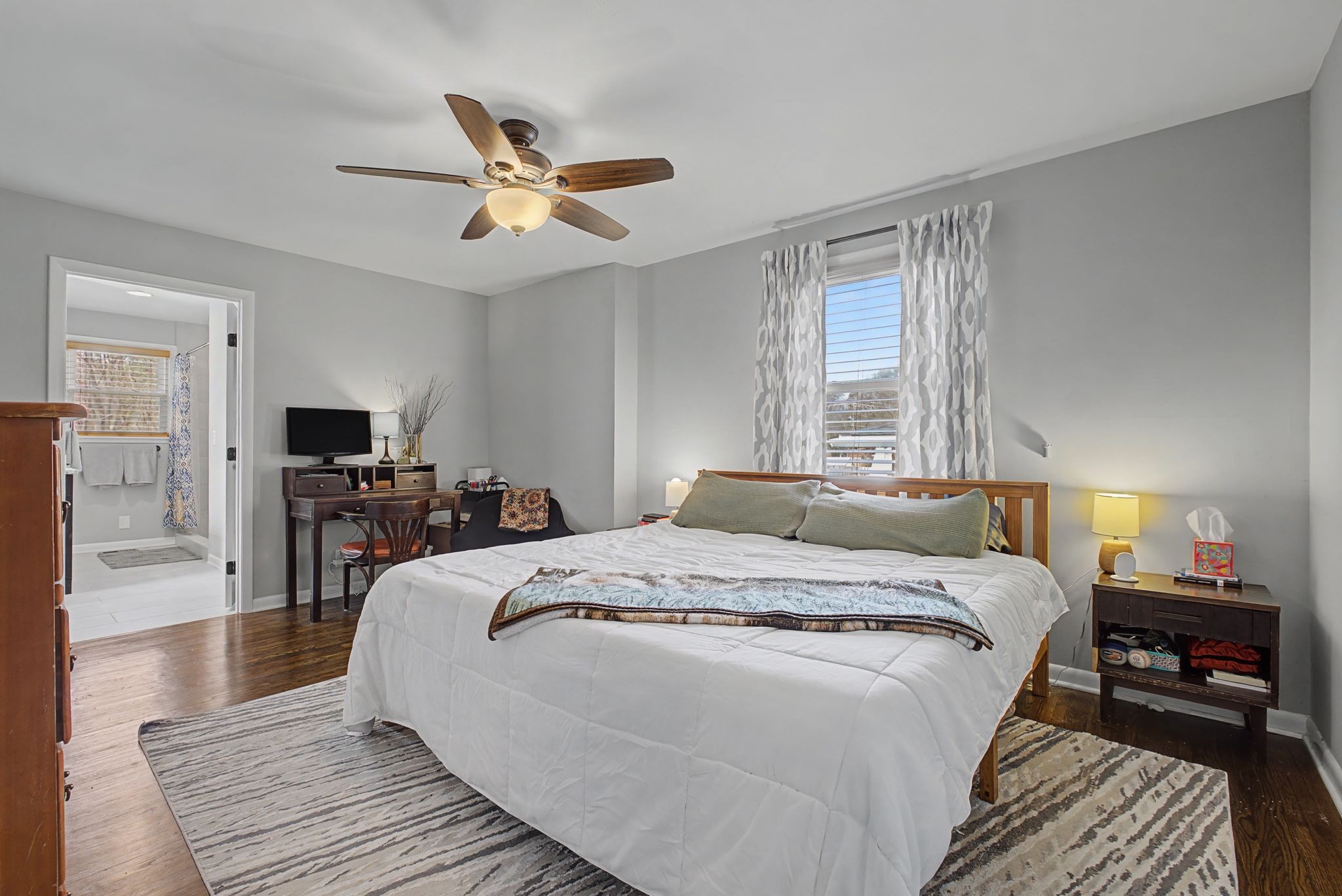 820 Allen Road Nashville, TN 37214 - Photo 13 of 28 a bedroom with a bed and a chandelier