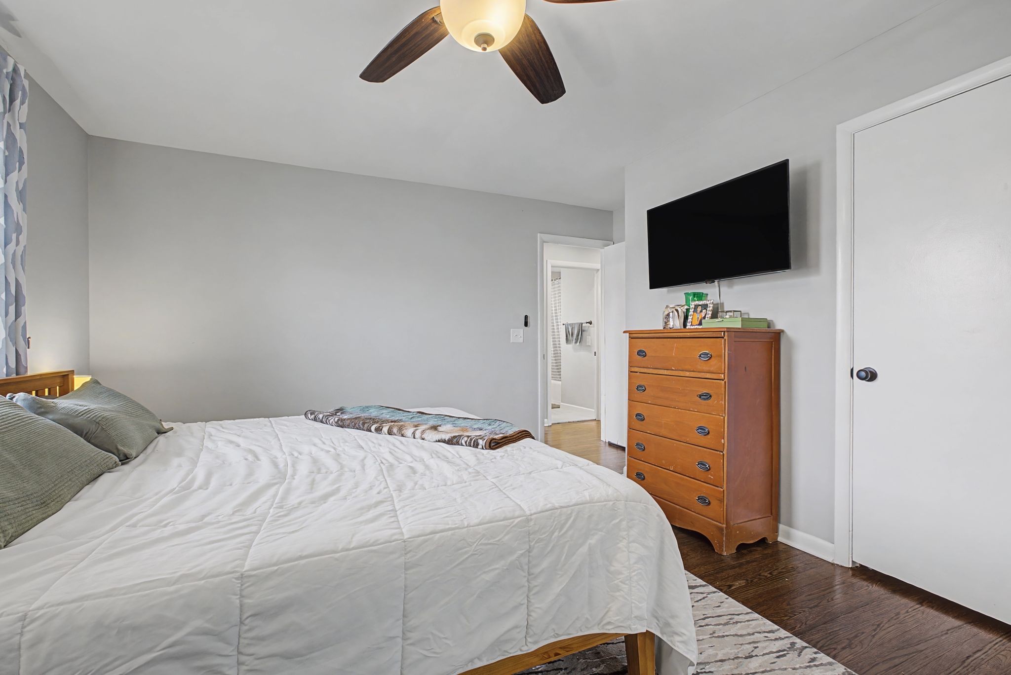 820 Allen Road Nashville, TN 37214 - Photo 14 of 28 a bedroom with a bed and a flat screen tv