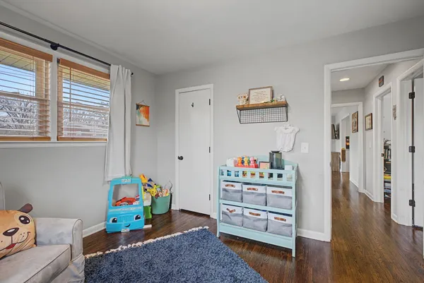 a room with toys and a wooden floor