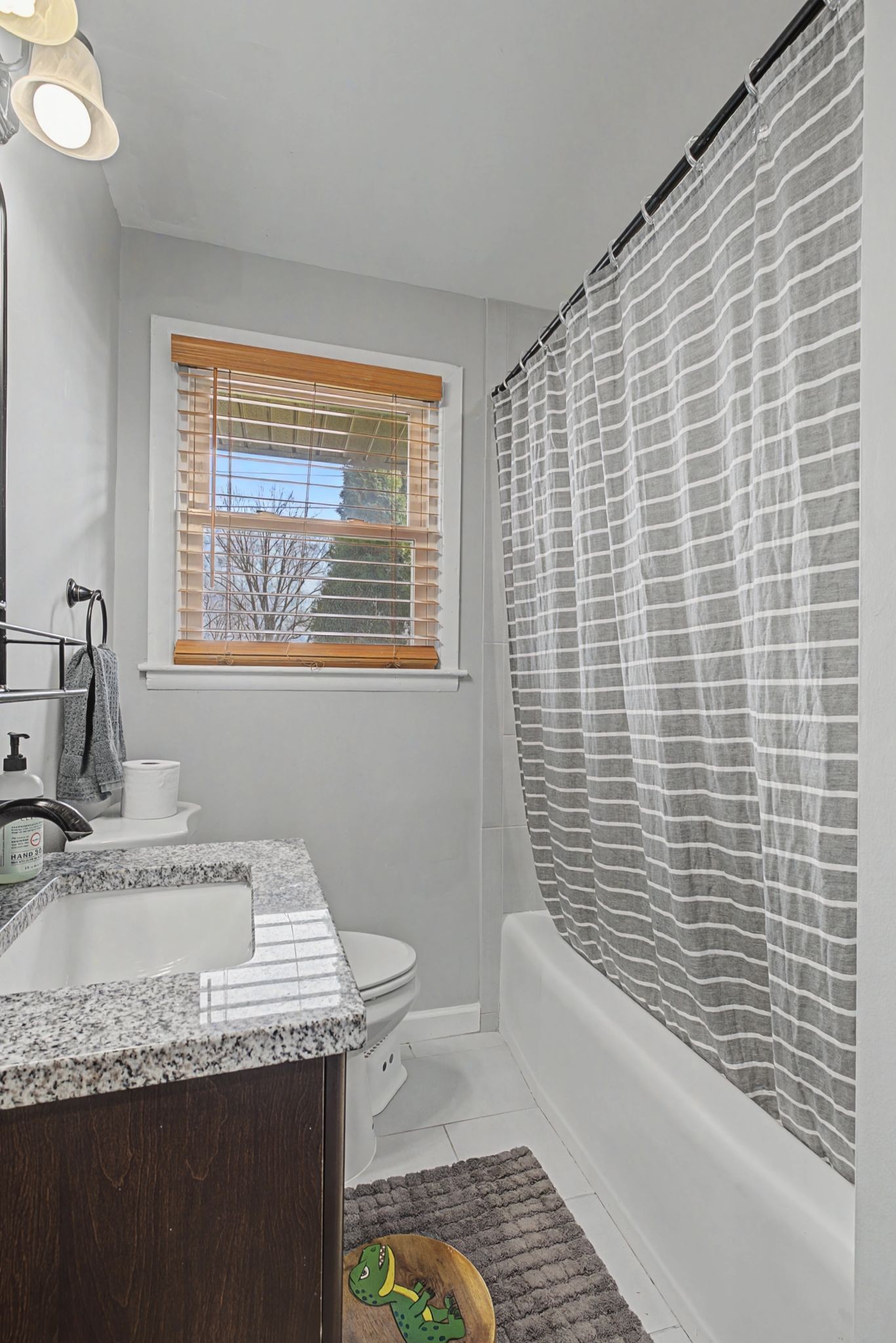 820 Allen Road Nashville, TN 37214 - Photo 19 of 28 a bathroom with a granite countertop sink a toilet and bathtub