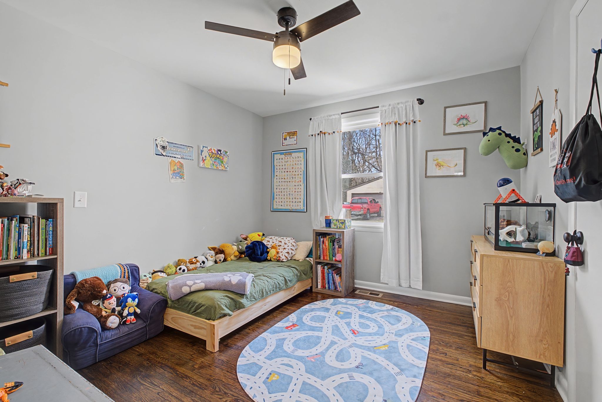 820 Allen Road Nashville, TN 37214 - Photo 22 of 28 a bedroom with furniture and a wooden floor