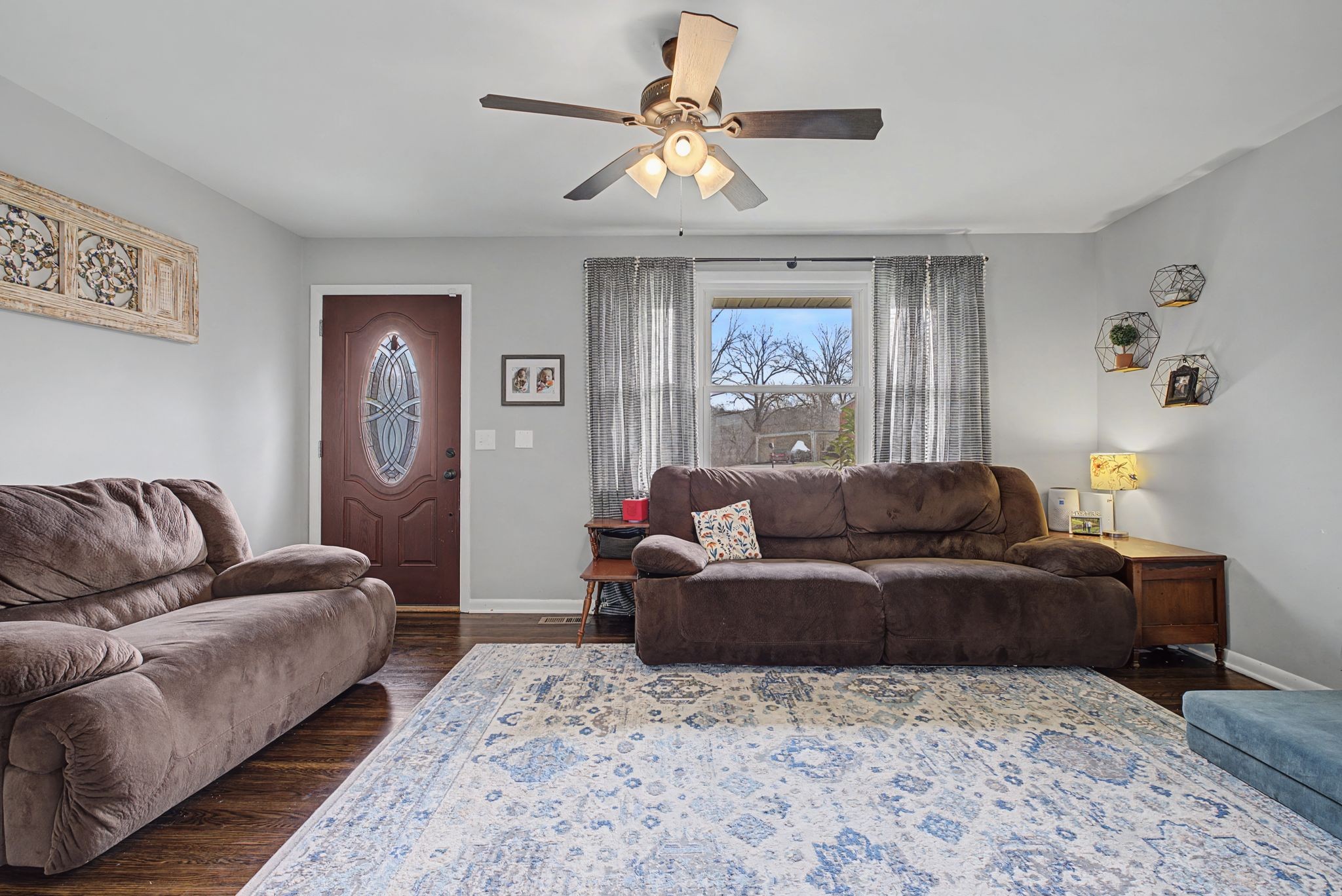 820 Allen Road Nashville, TN 37214 - Photo 5 of 28 a living room with couches a fireplace and a window