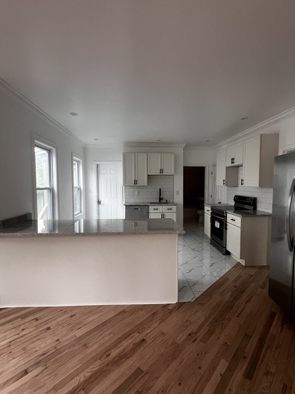 19 Reeves Street Worcester, MA 01607 - Photo 4 of 30 a view of kitchen with wooden floor