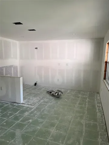 a view of an empty room and window