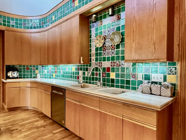 a view of a kitchen from the hallway
