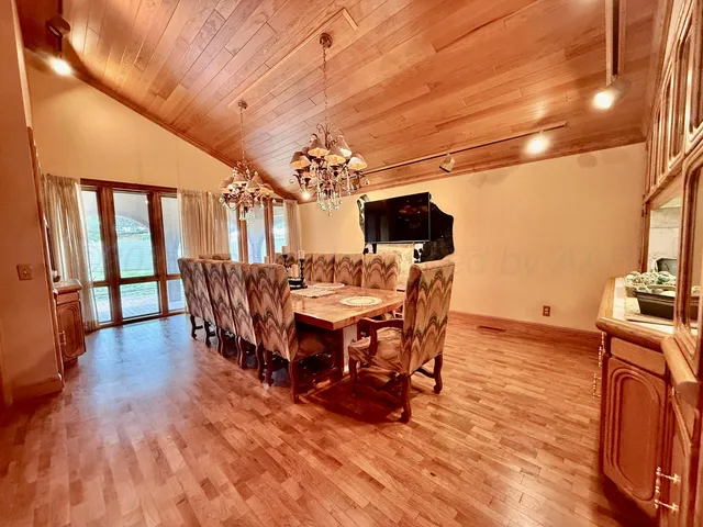 a view of a swimming pool with chairs