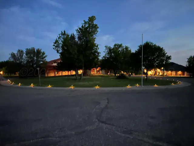 a bedroom with furniture and wooden floor