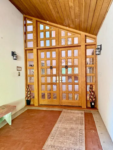 a view of a living room with kitchen