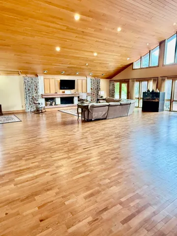 a living room with a fireplace furniture and a flat screen tv