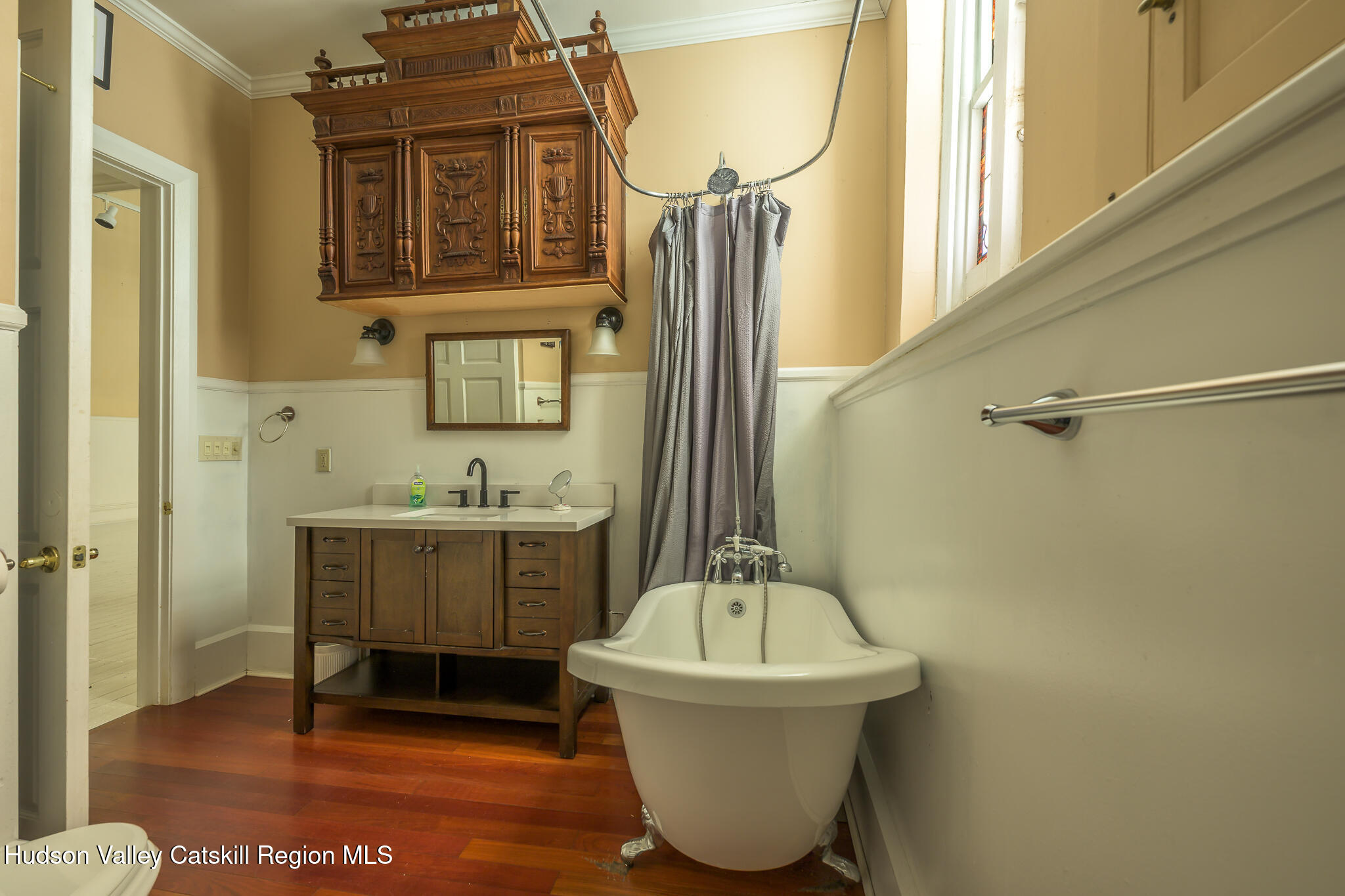 428 State Street Hudson, NY 12534 - Photo 13 of 23 a bathroom with a sink and a mirror