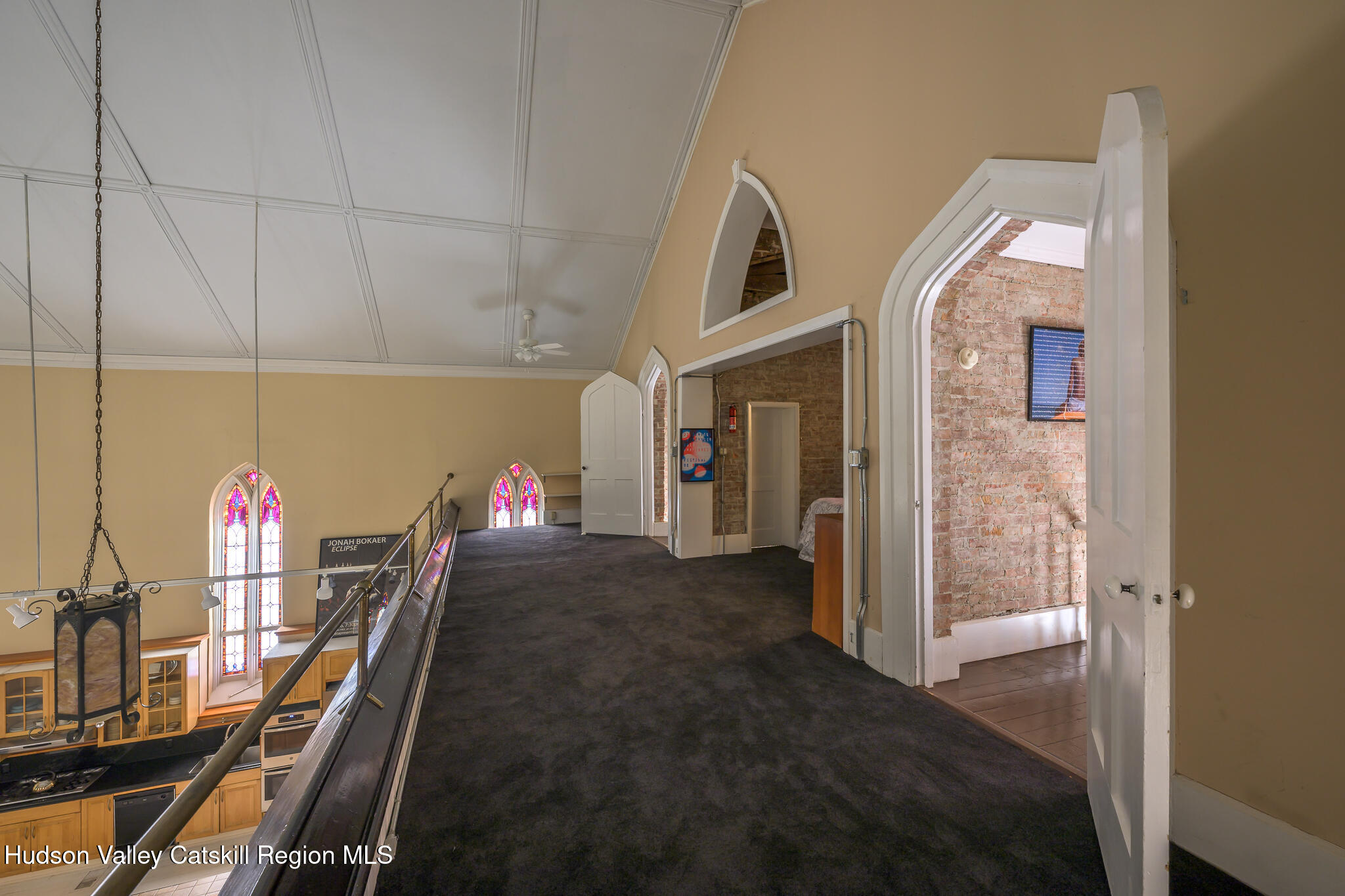 428 State Street Hudson, NY 12534 - Photo 20 of 23 a view of a hallway to a livingroom with furniture