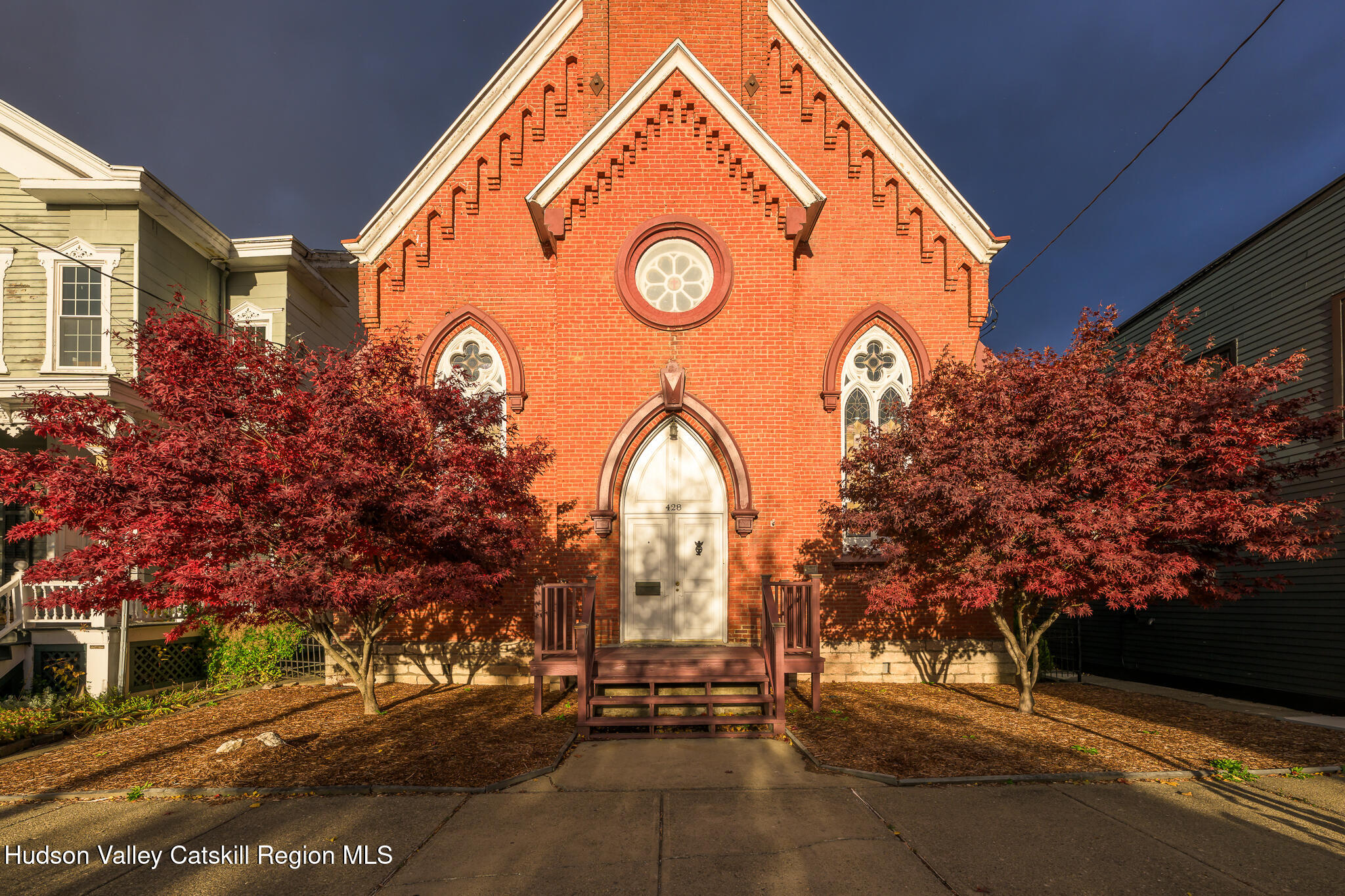 428 State Street Hudson, NY 12534 - Photo 2 of 23 a view of a house with a yard and garage