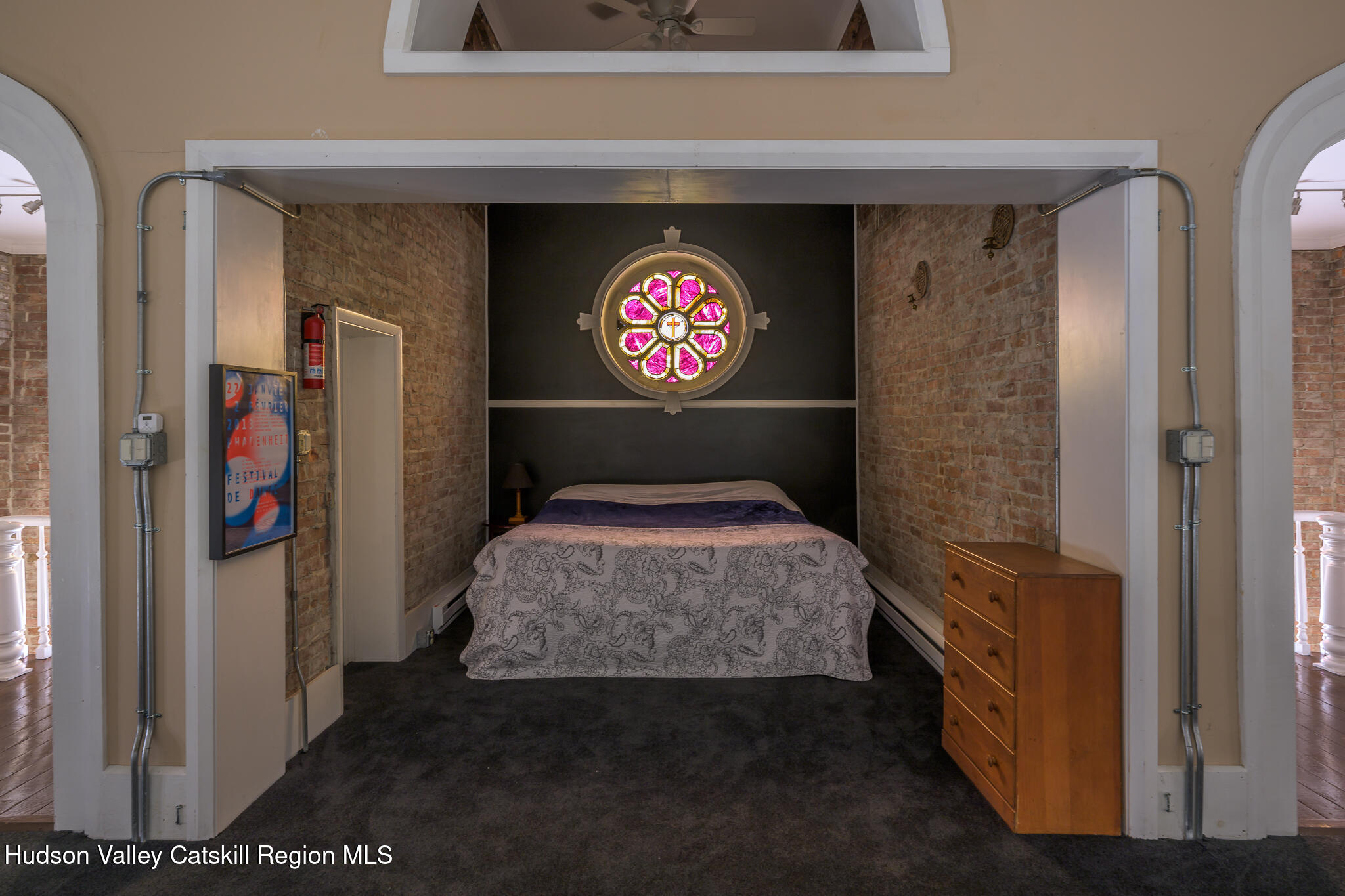 428 State Street Hudson, NY 12534 - Photo 21 of 23 a bedroom with a bed and a walk in closet